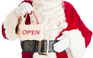 santa-holding-open-sign